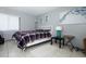 Comfortable bedroom featuring tile floors, neutral walls and a large window at 5027 Vineland Rd # 5027, Orlando, FL 32811