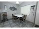 Modern dining area featuring sleek table, modern decor, and lots of light at 5027 Vineland Rd # 5027, Orlando, FL 32811