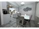 Dining and kitchen area offering natural light and modern finishes at 5027 Vineland Rd # 5027, Orlando, FL 32811