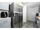 Kitchen with stainless steel refrigerator and plenty of counter space at 5027 Vineland Rd # 5027, Orlando, FL 32811