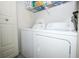 Laundry room featuring a full-sized washer and dryer at 5027 Vineland Rd # 5027, Orlando, FL 32811