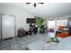 Cozy living room with tile floors, sliding glass doors, and ample natural light at 5027 Vineland Rd # 5027, Orlando, FL 32811