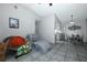 Bright living room with tile floors that connects seamlessly to the dining area and kitchen at 5027 Vineland Rd # 5027, Orlando, FL 32811