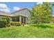 This backyard features a screened-in porch with lush grass and a beautiful tree, perfect for outdoor relaxation at 513 Legacy Park Dr, Casselberry, FL 32707
