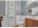 A powder bathroom features stylish vanity with a marble top and a convenient door to the outside at 513 Legacy Park Dr, Casselberry, FL 32707