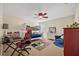 Bedroom featuring a bunk bed, gaming desk, comfortable chair, ceiling fan, and an area rug at 513 Legacy Park Dr, Casselberry, FL 32707