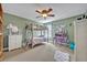 Bedroom with a ceiling fan, bunk beds, a writing desk, a white furry rug, and a window providing light at 513 Legacy Park Dr, Casselberry, FL 32707