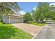 A home featuring a neutral color scheme, a large driveway, and a green lawn and playground in the yard at 513 Legacy Park Dr, Casselberry, FL 32707