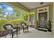 Welcoming front porch with seating and a decorative door at 513 Legacy Park Dr, Casselberry, FL 32707