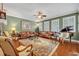Spacious living room featuring hardwood floors, comfortable seating, and a ceiling fan at 513 Legacy Park Dr, Casselberry, FL 32707
