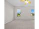 This is a large bedroom with two windows, carpet and a ceiling fan at 5339 Pond Crossing Pl, Leesburg, FL 34748