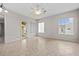 Bright bedroom with tile flooring, natural light, a ceiling fan and an outdoor door at 5339 Pond Crossing Pl, Leesburg, FL 34748