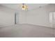 Expansive bedroom with carpet flooring, natural light, and ceiling fan at 5339 Pond Crossing Pl, Leesburg, FL 34748
