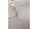 Spacious bedroom features neutral carpeting and a ceiling fan at 5339 Pond Crossing Pl, Leesburg, FL 34748