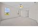 Bright bedroom with carpet flooring, natural light, and ceiling fan at 5339 Pond Crossing Pl, Leesburg, FL 34748