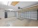 This garage features two doors and concrete flooring and block walls at 5339 Pond Crossing Pl, Leesburg, FL 34748