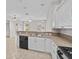Stylish kitchen featuring stainless steel appliances and breakfast bar at 5339 Pond Crossing Pl, Leesburg, FL 34748