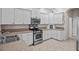 Well-equipped kitchen with stainless steel appliances and ample cabinet space at 5339 Pond Crossing Pl, Leesburg, FL 34748