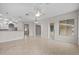 Spacious living room with tile flooring, ceiling fan, and abundant natural light at 5339 Pond Crossing Pl, Leesburg, FL 34748