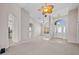 Open-concept living space with archways and neutral tones, creating an airy feel at 5339 Pond Crossing Pl, Leesburg, FL 34748