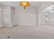 Expansive living room with neutral tones and carpet, offering a versatile space at 5339 Pond Crossing Pl, Leesburg, FL 34748