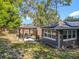 The property's backyard features a shaded gazebo and lush greenery that offers a relaxing outdoor retreat at 604 Thrush Ave, Longwood, FL 32750
