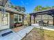 View of the backyard with a pergola, seating, and a landscaped walkway at 604 Thrush Ave, Longwood, FL 32750