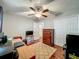 Bedroom setup as an office space with a desk and dresser near the closet doors at 604 Thrush Ave, Longwood, FL 32750