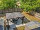 Backyard aerial featuring a gazebo, table set, and privacy fence, creating an inviting outdoor retreat at 604 Thrush Ave, Longwood, FL 32750