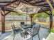 Covered gazebo with an umbrella and outdoor furniture set provides a charming space for relaxation and entertainment at 604 Thrush Ave, Longwood, FL 32750