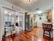 Cozy kitchen features stainless steel refrigerator and open access to a living room through glass paneled doors at 604 Thrush Ave, Longwood, FL 32750