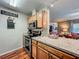 Updated kitchen with stainless steel appliances and light wood cabinets at 604 Thrush Ave, Longwood, FL 32750