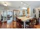 Bright kitchen features a large island with seating, stainless steel appliances, and hardwood floors at 604 Thrush Ave, Longwood, FL 32750