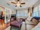 Open living room showcases stylish decor and seamless transition to another room through elegant glass-paneled doors at 604 Thrush Ave, Longwood, FL 32750