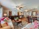 The open concept living room features hardwood floors, neutral walls, and plenty of seating at 604 Thrush Ave, Longwood, FL 32750