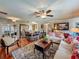 Inviting living room boasts hardwood floors, comfortable seating, and a ceiling fan for added comfort at 604 Thrush Ave, Longwood, FL 32750