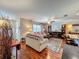 Bright living room boasts hardwood floors, lots of decor, and a neutral color scheme at 604 Thrush Ave, Longwood, FL 32750