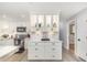 Kitchen area showcasing new white cabinetry and modern countertops with under cabinet lighting at 692 Gaslight Dr, South Daytona, FL 32119