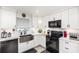 Kitchen with black appliances, light countertops, and a deep basin sink at 692 Gaslight Dr, South Daytona, FL 32119