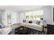 Living room with modern decor, large windows, and hardwood flooring at 692 Gaslight Dr, South Daytona, FL 32119