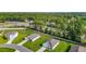 Beautiful aerial view of a neighborhood featuring single story homes, green lawns and a treeline at 7161 Sw 135Th Pl, Ocala, FL 34473