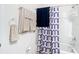 Bathroom with modern designed shower curtain, tub and shower combo at 7161 Sw 135Th Pl, Ocala, FL 34473