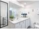 Well-lit bathroom with double sinks, vanity, and contemporary design at 7161 Sw 135Th Pl, Ocala, FL 34473