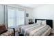Serene bedroom with comfortable bed, natural light, and decorative accents at 7161 Sw 135Th Pl, Ocala, FL 34473