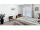 Bedroom with comfortable furnishings, window, and cozy ambiance at 7161 Sw 135Th Pl, Ocala, FL 34473