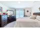 Comfortable bedroom with natural light and dark wood dresser at 7161 Sw 135Th Pl, Ocala, FL 34473