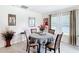 Cozy dining area with a round table, seating for four, and natural lighting at 7161 Sw 135Th Pl, Ocala, FL 34473