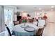 Dining room, with view into the living room and island kitchen at 7161 Sw 135Th Pl, Ocala, FL 34473