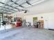 Spacious two car garage with overhead door and room for storage at 7161 Sw 135Th Pl, Ocala, FL 34473