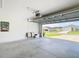 Spacious two car garage with overhead door to exterior view at 7161 Sw 135Th Pl, Ocala, FL 34473
